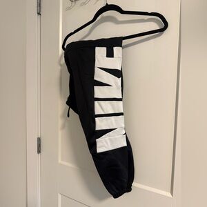 Nike Kids M/Women’s XS Black Joggers with Bold White Logo